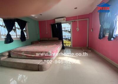 Bedroom with colorful walls, curtains, and bed