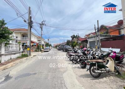 Street view with houses and motorbikes
