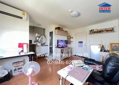 Living room with various furnishings and appliances