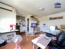 Living room with various furnishings and appliances