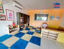 Children's playroom with colorful mats and toys