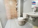 Modern bathroom with tiled shower, toilet and sink