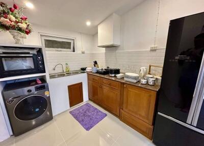 A kitchen with appliances and a sink