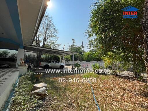 Front yard with covered parking and driveway