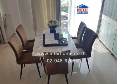 Dining table with chairs and flowers