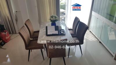 Dining table with chairs and flowers