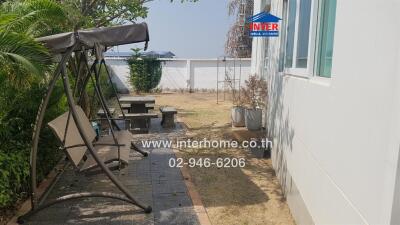 Outdoor area with swing and table