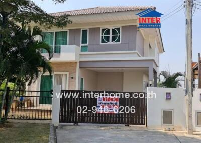 Two-story house with gated front yard