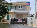 Two-story house with gated front yard