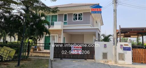 Two-story house with gated front yard