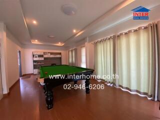 Recreation room with pool table and modern decor