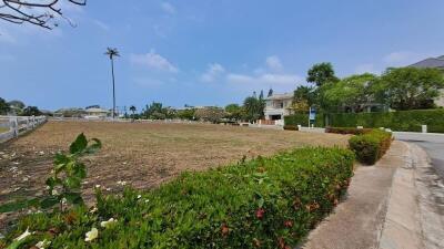 Vacant land surrounded by greenery in a residential area