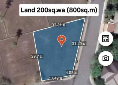 Plot of land with measurements and location marker
