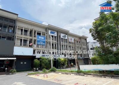 Front view of building complex with parking space