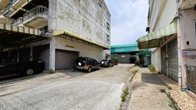 Exterior view of the building with a parking area