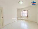 Empty bedroom with a window and curtain, white tiled floor