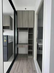 Hallway with built-in storage and fridge