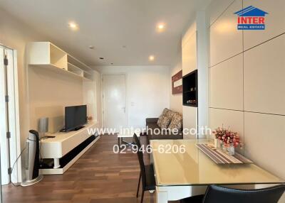 Modern living room with dining space and entertainment setup