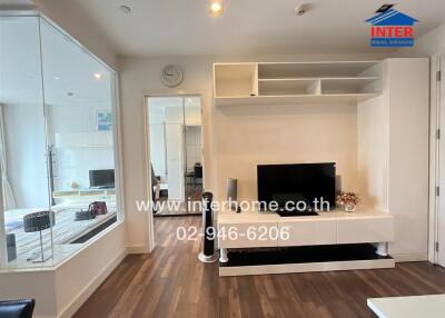 Contemporary living room with TV and shelf unit