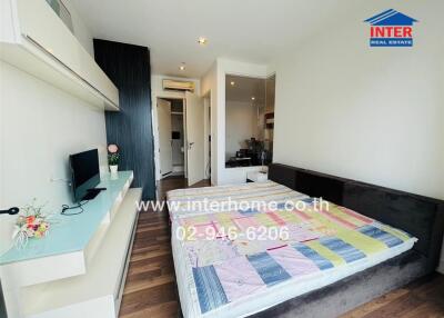 Spacious bedroom with modern decor and a comfortable bed
