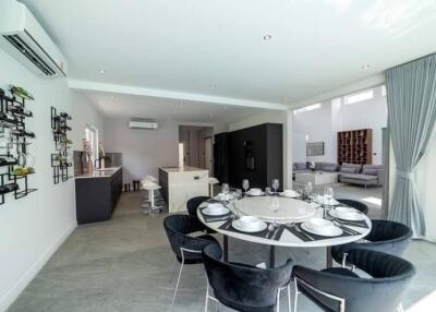 Modern open-plan dining and living area with a kitchen