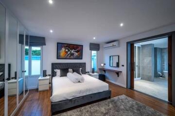 Spacious bedroom with modern decor and en suite bathroom