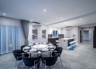 Modern dining area connected to a stylish kitchen