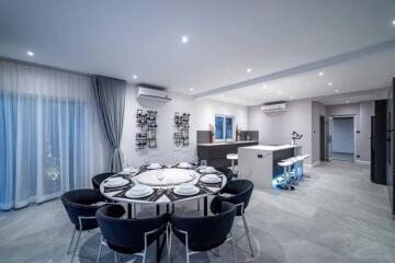 Modern dining area connected to a stylish kitchen