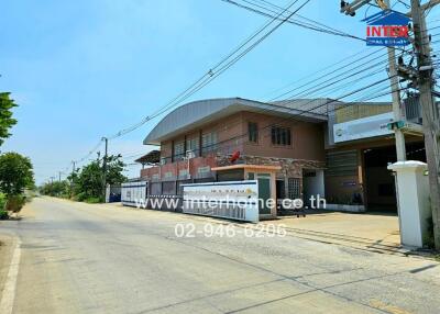 Factory building with adjacent office on a clear day