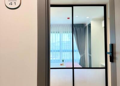 Bedroom view with glass partition and curtains