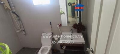 Modern bathroom with white fixtures and a window