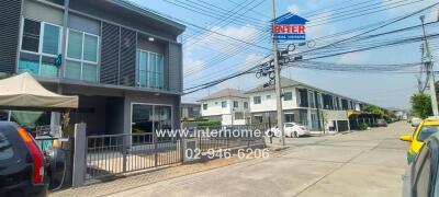 Modern townhouse with balcony and driveway