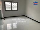 Bedroom with two windows and tiled floor