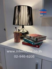 Nightstand with lamp and books