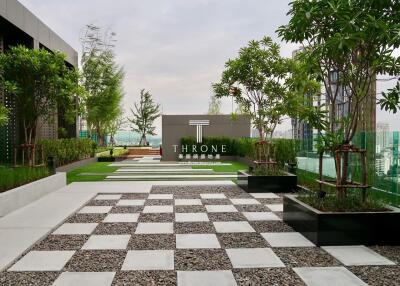 Modern rooftop garden with pathways and greenery