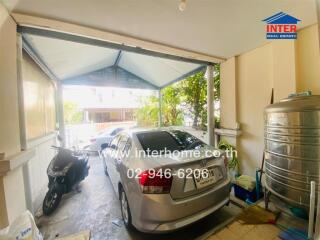 Car parked in a garage with additional storage space