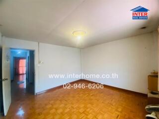 Spacious living room with wooden flooring