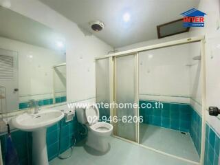 Clean and well-lit bathroom with modern fixtures