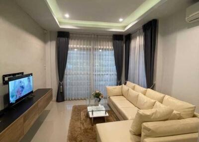 Modern living room with a sectional sofa and TV