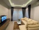 Modern living room with a sectional sofa and TV