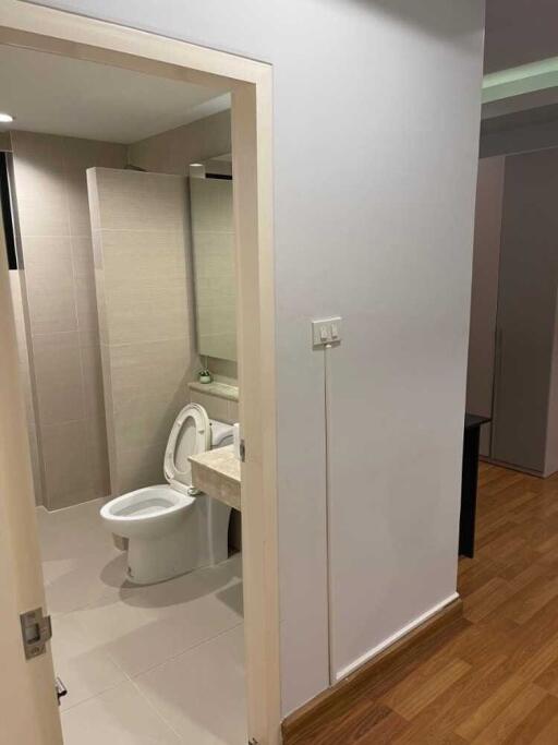Bathroom with toilet and partial sink view
