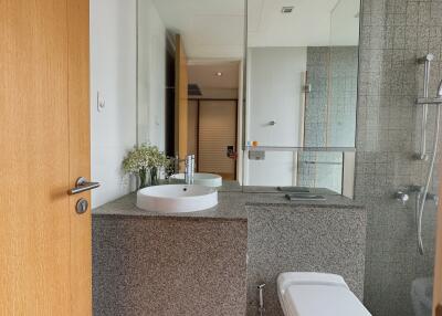 Modern bathroom with large mirror and floating sink