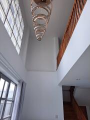 Modern interior with high ceiling and chandelier
