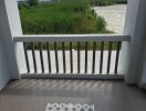 Balcony with tiled flooring and a railing view.