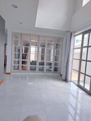 Bright living room with tiled floors and large windows