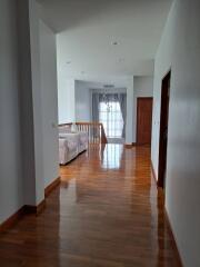 Bright living room with wooden floor and sofa