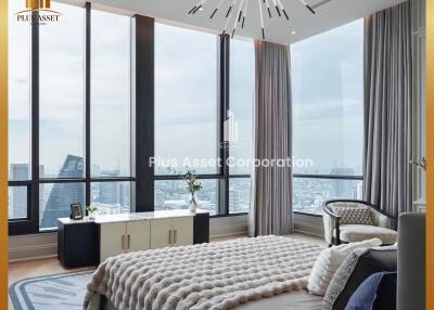 Luxury bedroom with large windows offering a city view