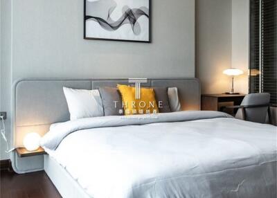 Modern bedroom with large bed and bedside lamps