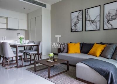 Modern living and dining area with gray and yellow accents