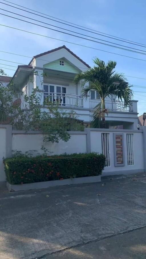 Exterior view of a two-story house with a front yard